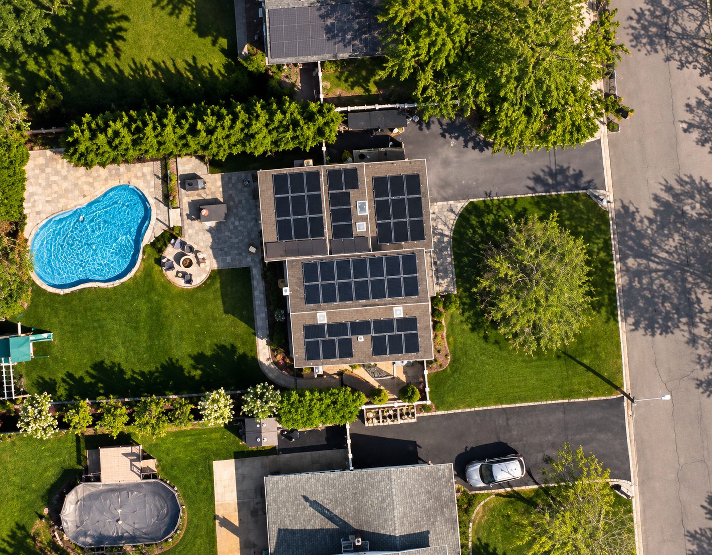 Aerial view of a Medford home with solar on multiple roof sections