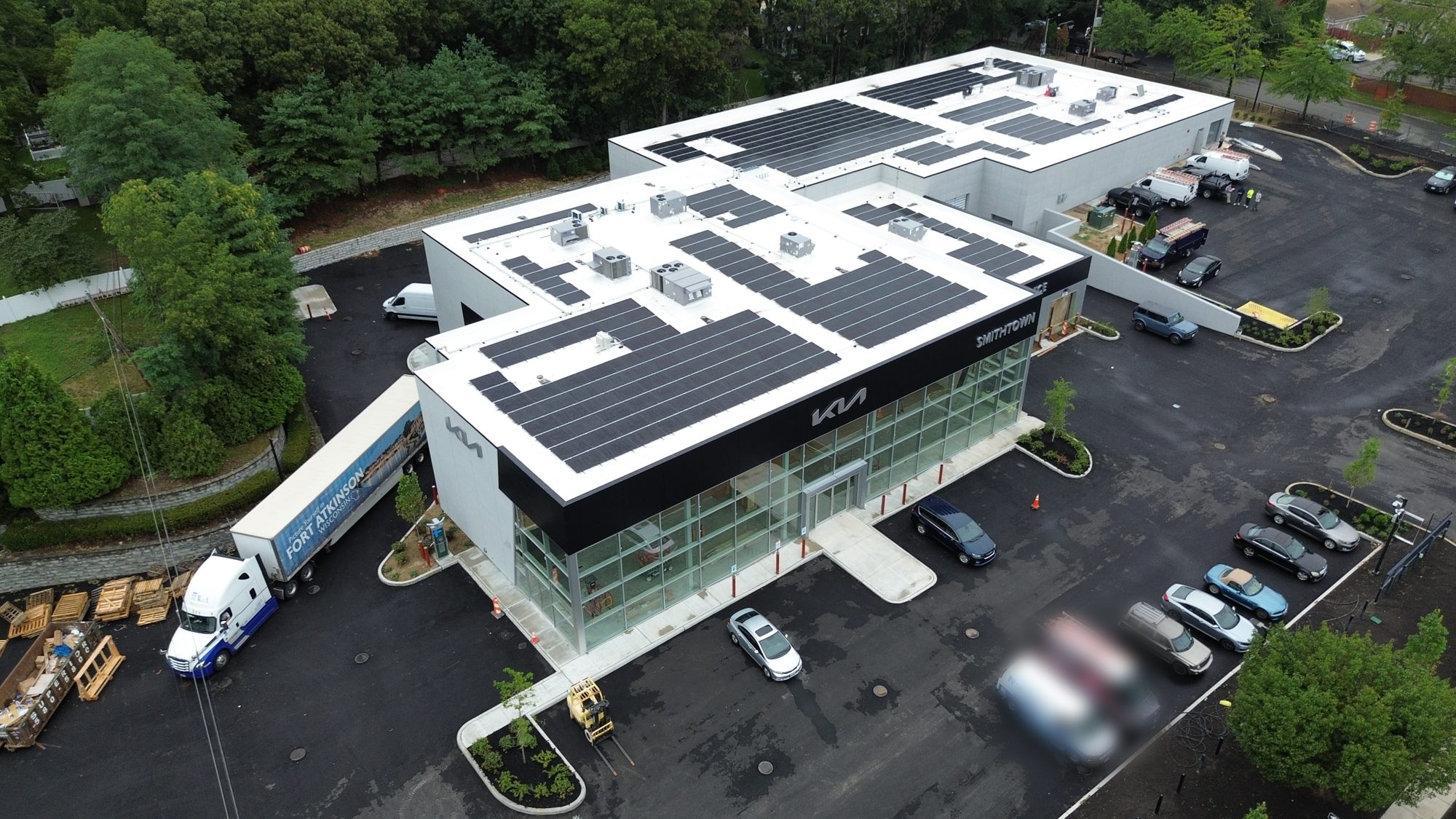 Aerial view of Smithtown Kia with rooftop commercial solar panels