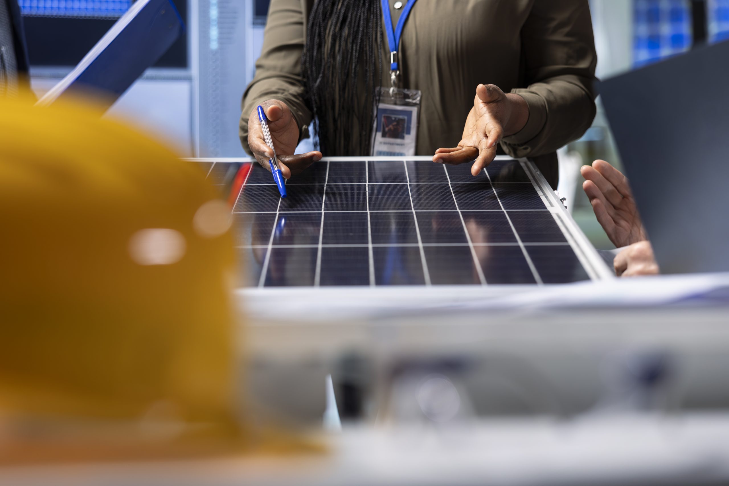 Shareholders reviewing solar panel components, analyzing material quality A professional explaining the entire solar panel installation process. To get a free estimate, call us today.<br />